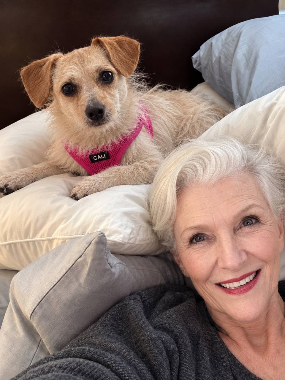 A selfie with Cali propped up on cushions